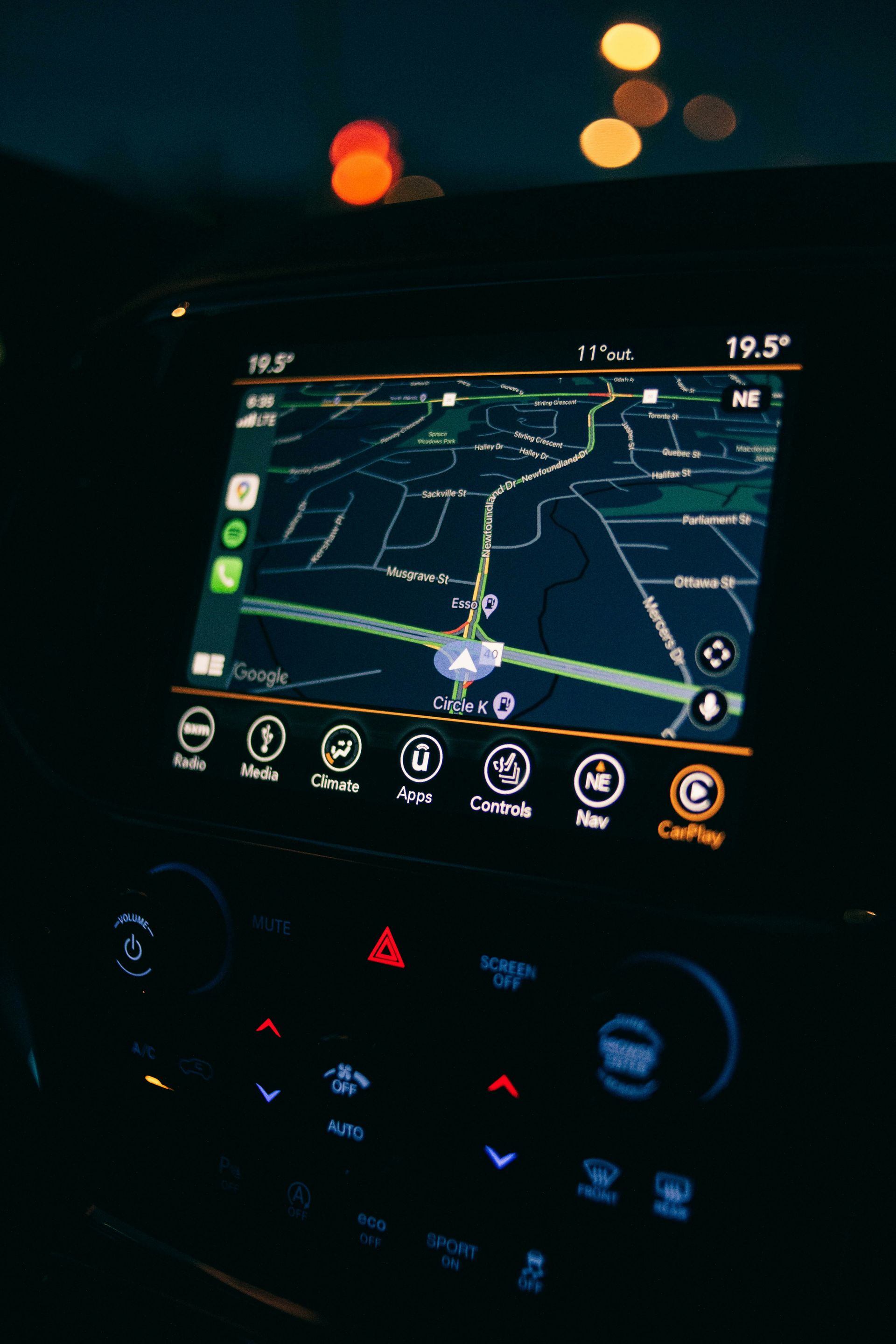 a car dashboard with a gps device in the middle of it