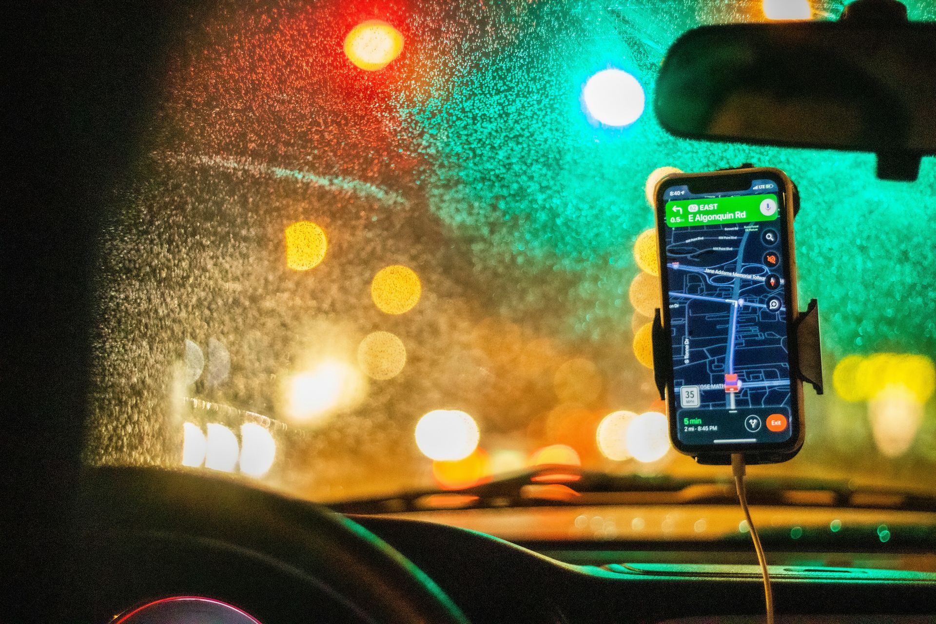 white smartphone on car dashboard
